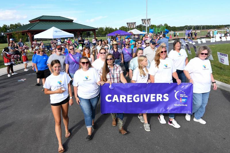 The caregivers walk with their survivors.