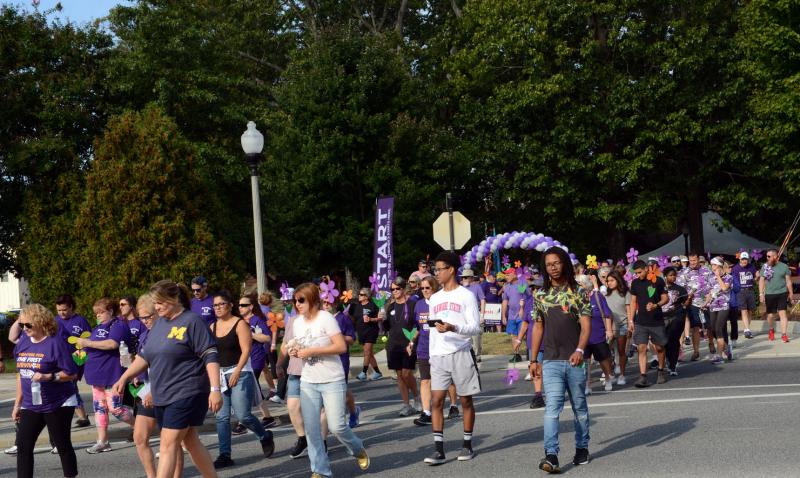 Participants in the 2019 Walk to End Alzheimer’s head out of Grove Park. FILE PHOTO