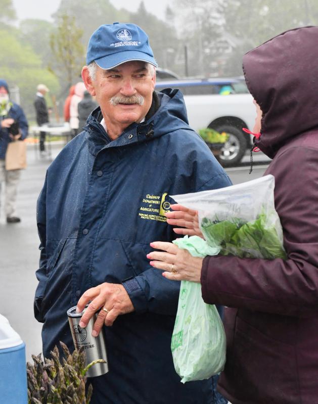 Delaware Agriculture Department Secretary Michael Scuse is out in all kinds of weather talking with farmers. A strong farmers market advocate, he attended the blustery opening of the Historic Lewes Farmers Market in April.