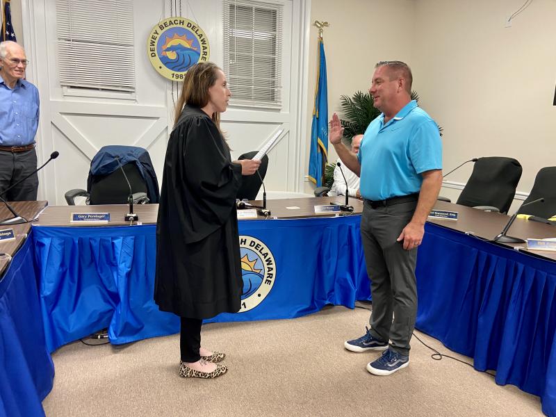 Commissioners unanimously voted to elect Bill Stevens to serve a second one-year term as mayor. Stevens is sworn in by Dewey Beach Alderman Kelly Pettyjohn. ELLEN DRISCOLL PHOTOS