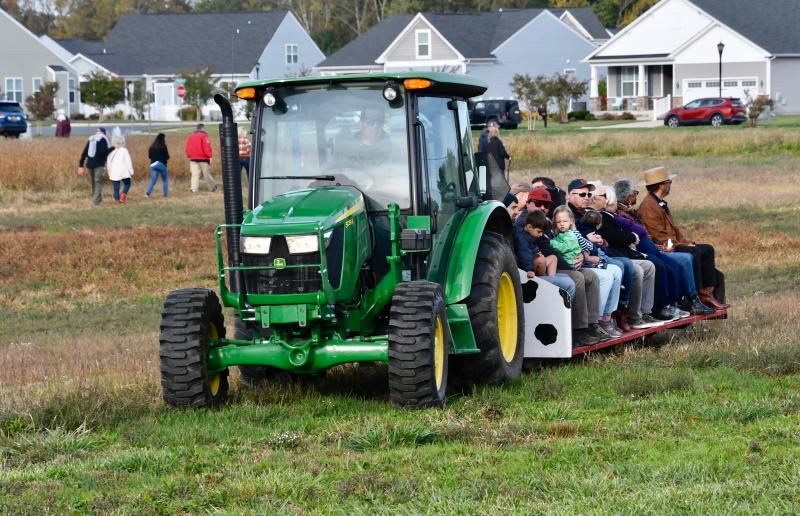 While some attendees walked from the parking area, others took advantage of a tractor-pulled shuttle.