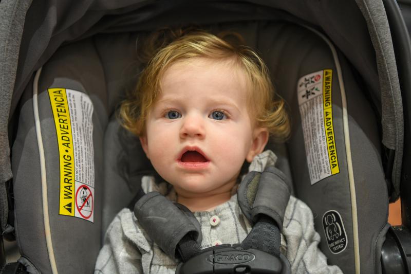 Alexandra Riedel sits on a lunch table, a clear violation of school rules, but gets a baby waiver. DAVE FREDERICK PHOTOS