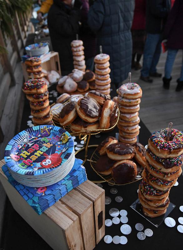 The Chabad of Southern Delaware offers sweets to begin the lighting of the menorah.