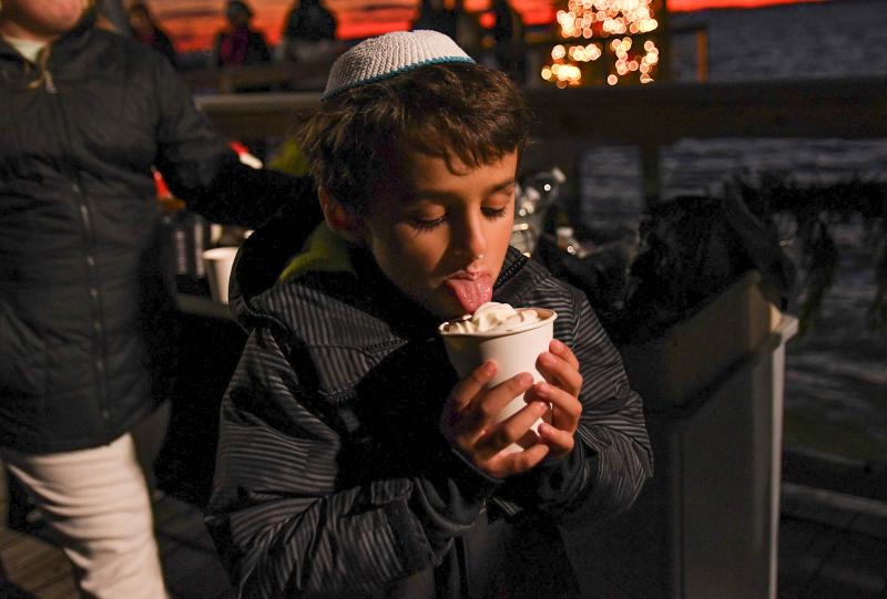 Aiden Stegall, 7, enjoys the hot chocolate given out at the event.