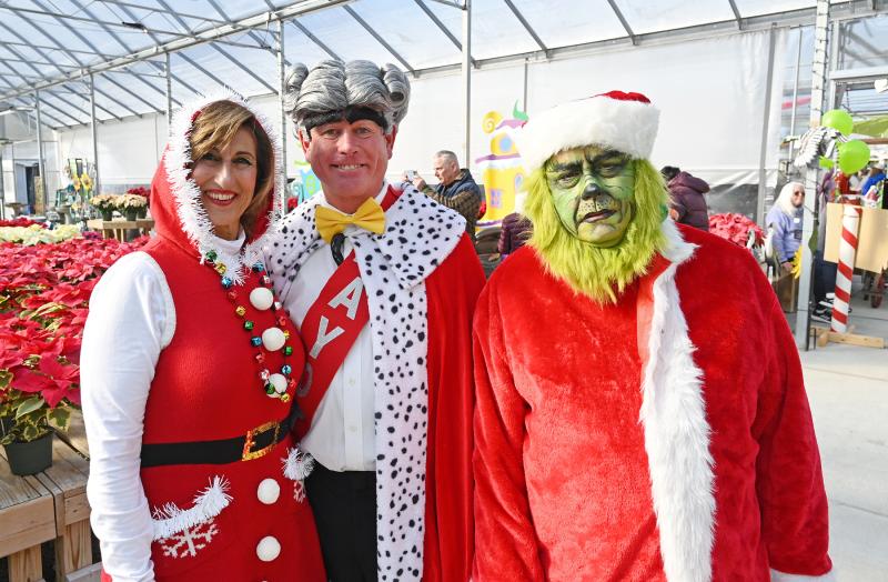 Greeting guests at East Coast Garden Center Dec. 10 are Martha May, Mayor Augustus Maywho and the mean one himself, the Grinch. Portraying the characters are (l-r) Cindy Spencer, Mark Voelkel and Doug Zimmerman. NICK ROTH PHOTOS