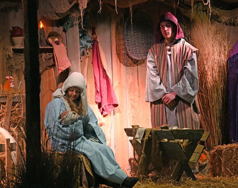 Mary and Joseph look after baby Jesus.