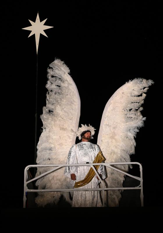An angel stands 30 feet over the manger.