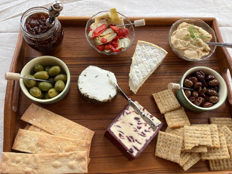 This board includes three different cheeses along with olives, fig spread, hummus and marinated artichokes. The spacing between items makes it easy to assemble selections on a cracker, then go back for a different combo. JACK CLEMONS PHOTO