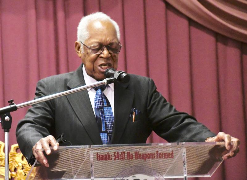 The Rev. George Edwards of Friendship Baptist Church in Lewes offers the invocation to begin the service.