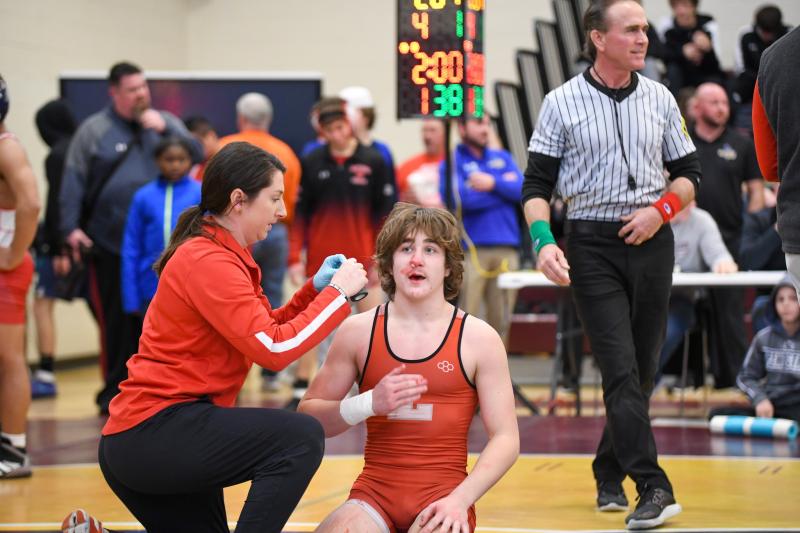 Stanley Pete of Laurel (138) is about to get plugged and wrapped. Pete would go on to win a conference championship for the Bulldogs. DAVE FREDERICK PHOTOS