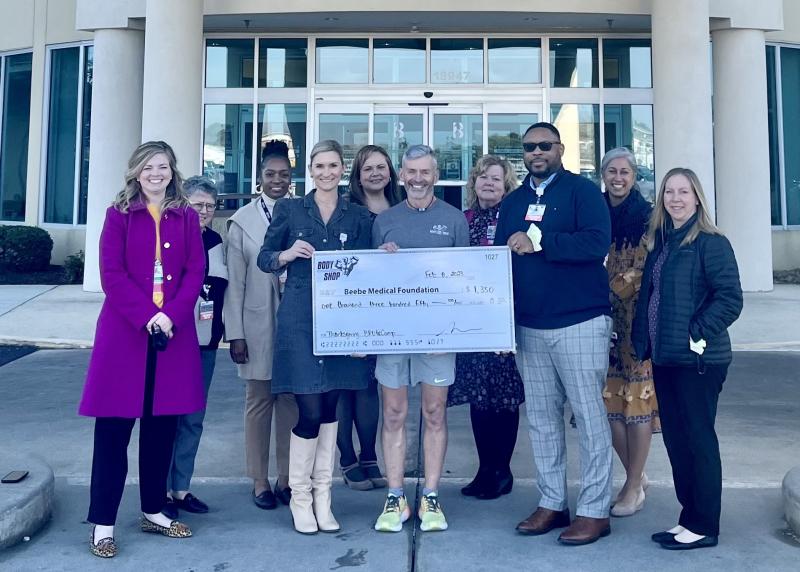 Check presentation attendees shown are (l-r) Stephanie Adams, Beebe Medical Foundation; Doreen DiLorenzo, oncology business office manager; Alexia Hines, radiation oncology manager; Leks Howard, clinical nurse II, Tunnell Cancer Center; Colleen Glasco, medical oncology practice manager; Bruce Clayton, TriCoach; Susan McCauley, oncology clinical care director; Maurice Winkfield, oncology services executive director; Rita Williams, oncology psychosocial services manager; and Amy Keller, Beebe Medical Foundation event coordinator. SUBMITTED PHOTO