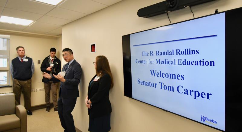 Beebe Healthcare President and CEO David Tam, center, leads a tour of the new R. Randall Rollins Center for Medical Education during a visit by Sen. Tom Carper.