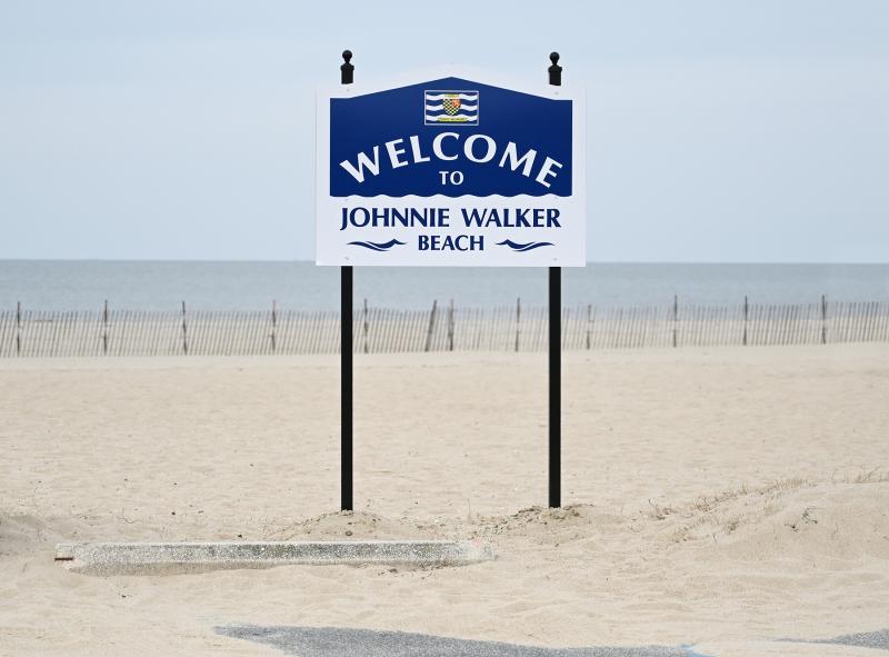 This new sign welcomes beachgoers to Johnnie Walker Beach. NICK ROTH PHOTOS
