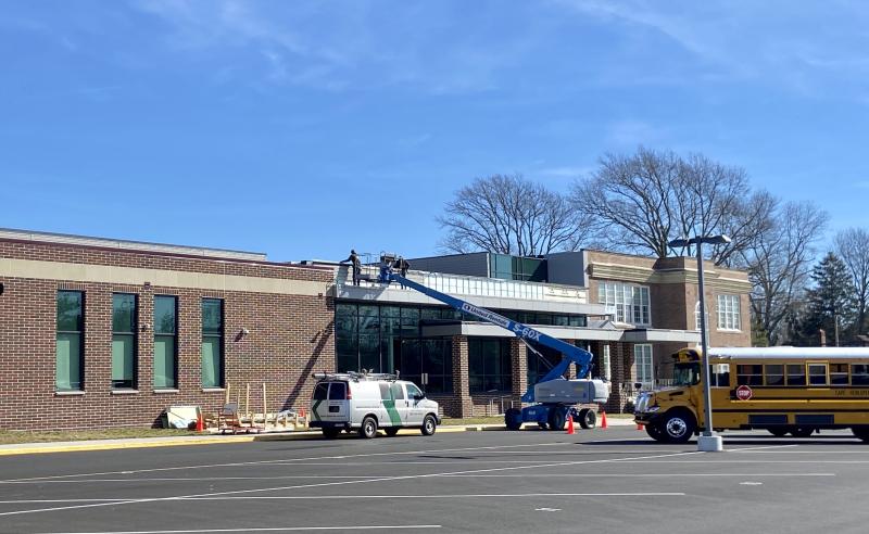 Workers were busy the morning of Feb. 14 installing composite panels above the bus entrance area at Lewes Elementary. The work will take about 10 days and is the final piece to be completed at the school, said Construction Manager Dean Johnson of Richard Y. Johnson. ELLEN DRISCOLL PHOTO