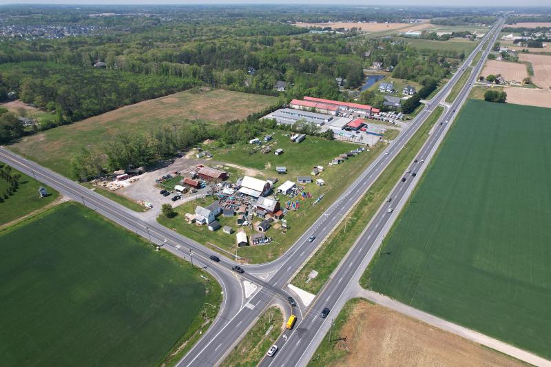 The 15-acre parcel for the Chappell Farm project includes land at the intersection of Route 1 (right) and Cave Neck Road (left), including the vacant field in the top left. NICK ROTH PHOTO