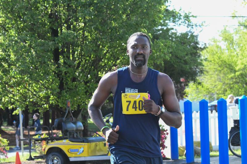 Enos Benbow crosses the finish line.