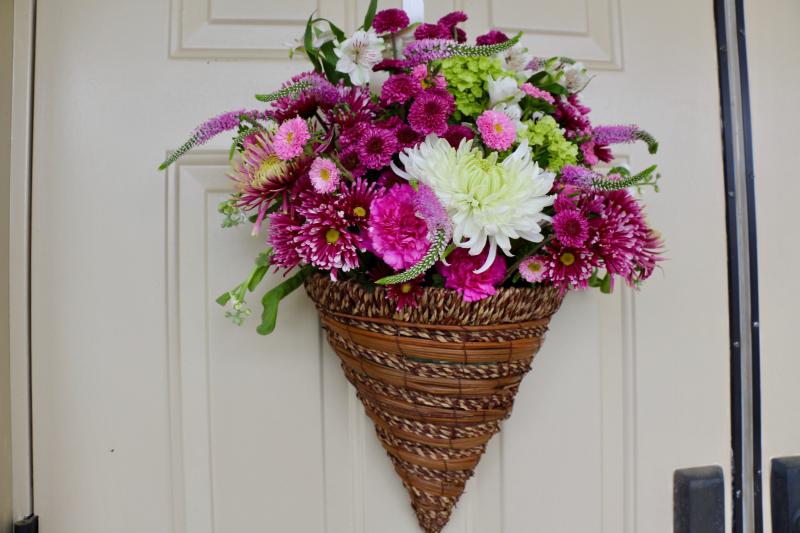 Lewes in Bloom hung this decorative basket during a special ceremony April 24 at city hall. LIB held a city-wide contest giving residents and businesses a chance to win prizes May 1. AARON MUSHRUSH PHOTO
