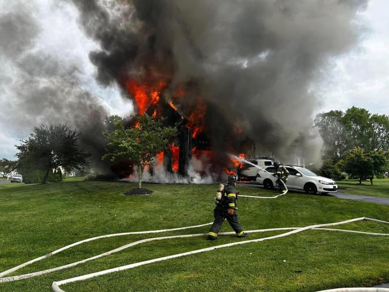 A fire burns a home in the Covington Chase neighborhood off Route 1. MILTON FIRE DEPARTMENT PHOTOS