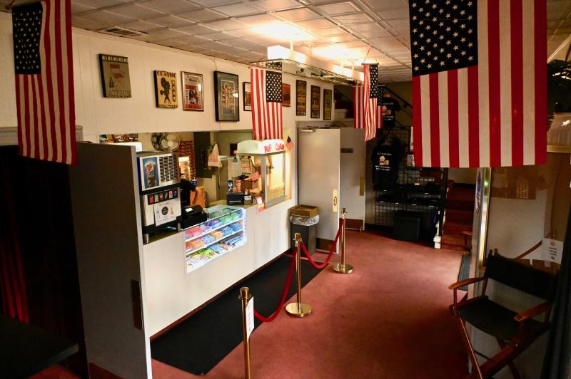 U.S. flags adorn the concession area and entrance of the Clayton Theater. RON MACARTHUR PHOTO
