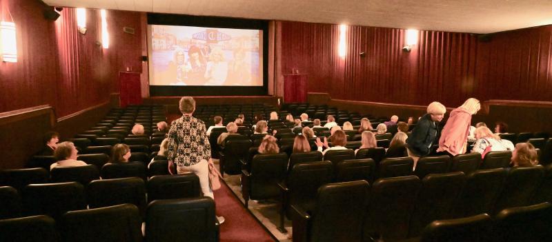 A crowd begins to form inside the Clayton Theater to watch the movie “Book Club 2.” Even with renovations and upgrades, the theater has retained its look for 74 years. RON MACARTHUR PHOTO