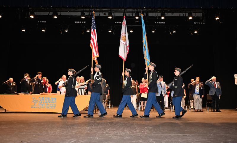 The cadet honor guard posts the colors to start the program.
