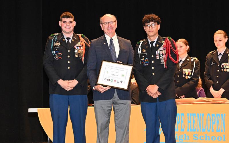 Rep. Jeffrey Hilovsky, R-Long Neck, receives a certificate of recognition from Cadet Battalion Commander Isaac League, left, and Bryan Ramirez.