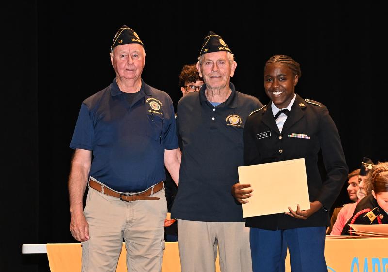 American Legion Post 28’s Jim Beattie and Joe Brown present the Award for Military Excellence to Cianna Steer.