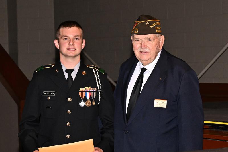 Christian Fuscellaro receives the Veterans of Foreign Wars Post 7447 Medal from Everett Beach.