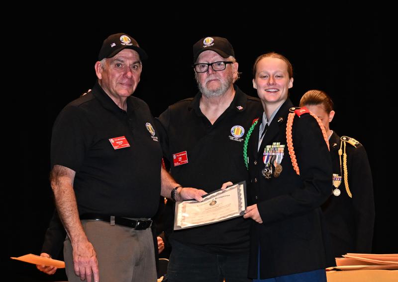 Addison Bowman receives the Vietnam Vets Association Medal from George Stone and Tom Wiker.