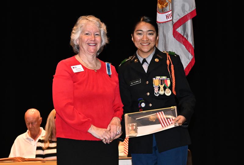 Linda Gutierrez receives an award from the Daughters of the American Revolution from Patricia Haas.