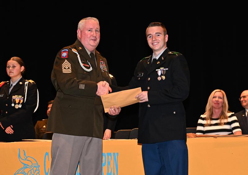 Colby Smith receives the 82nd Airborne Association JROTC Medal from Cape’s First Sgt. Philip Webb.