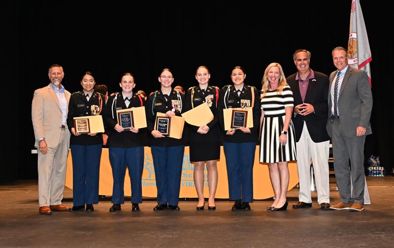 JROTC cadets Linda Gutierrez, Abigial Shaeffer, Rylee Tipton, Zoe Hendershot, and Ninfa Cantu receive the Chad Clifton Memorial Best Leader Staff Awards from former Rep. Steve Smyk, Principal Kristin DeGregory, former Sen. Ernie Lopez and Cape Superintendent Bob Fulton.