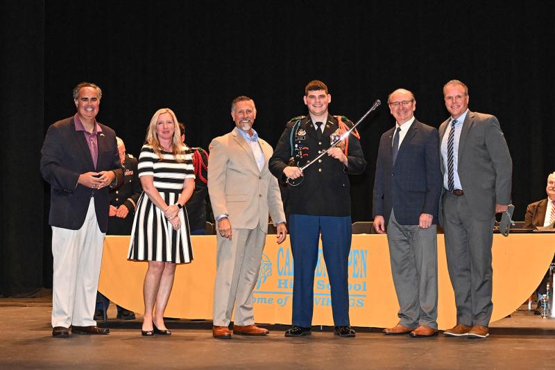 The 5th Avenue Jewelers Memorial Saber was presented to Cadet Battalion Commander Isaac League. Shown are (l-r) former Sen. Ernie Lopez, Cape Principal Kristin DeGregory, former Rep. Steve Smyk, League, Rep. Jeffrey Hilovsky and Cape Superintendent Bob Fulton. DAN COOK PHOTOS