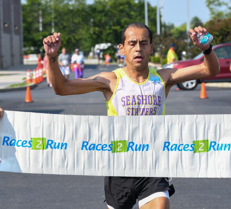 Martin Rodriguez wins the SoDel Cares 5K in 18:29.