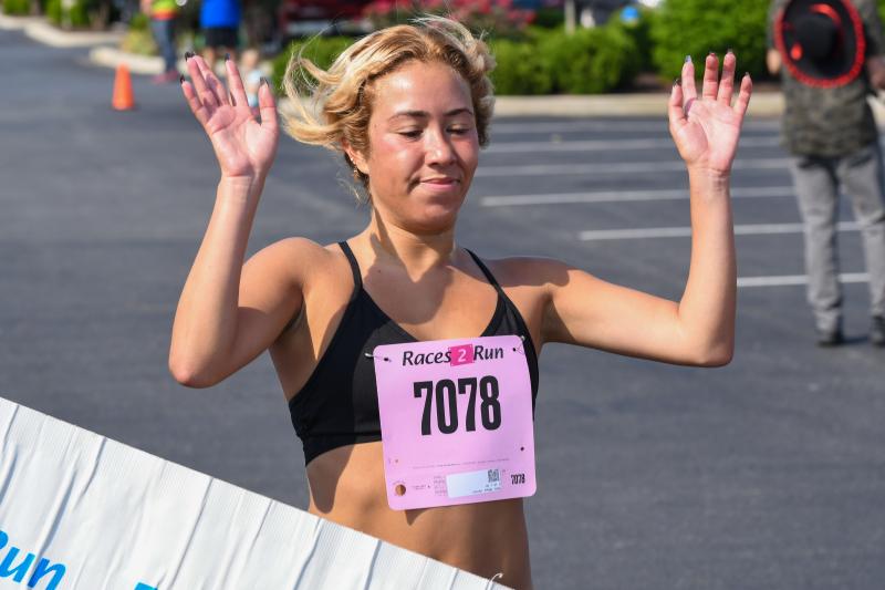 Tiffany Herrera is the first woman across the finish line in 19:27.