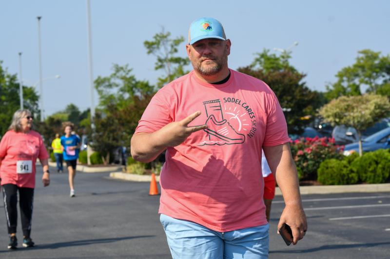 Scott Kammerer walks a mile in his shoes.