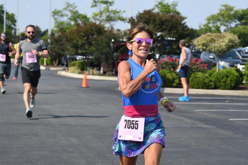 Rose Furio pushes to a time of 26:34.