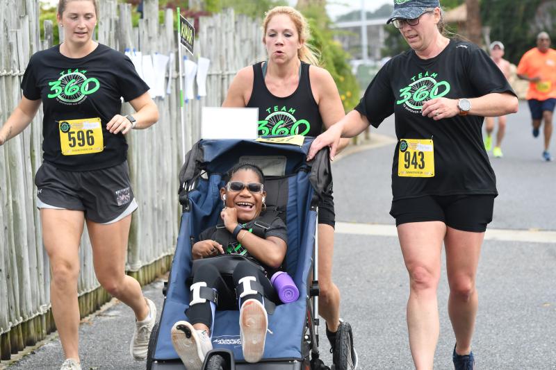 Team 360 supports Kimar Holcey. Shown are (l-r) Sara Younts, Jayme Del Vecchio and Tara Mildenberger. DAVE FREDERICK PHOTOS