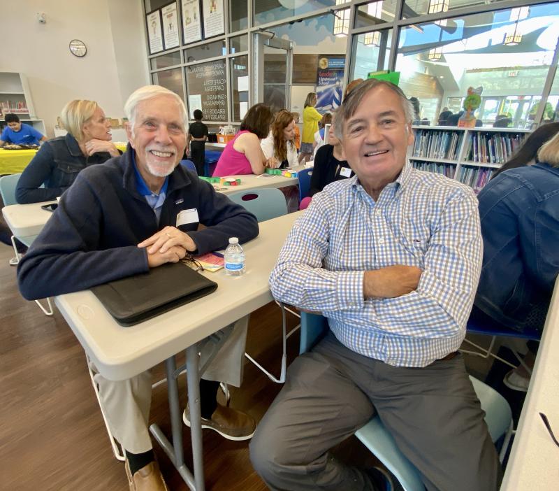 President of the Milton Community Foundation Steve Crawford, left, chats with Ken Brittingham, grandson of the school’s namesake Herman Oscar Brittingham.