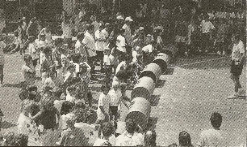 John Myers calls contestants together for the beginning of one of the barrel races on Second Street.