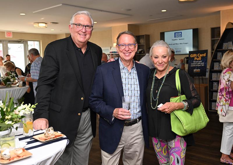 Enjoying the happy hour are (l-r) David Clark, Mike McNease and Stephanie Pavelic.