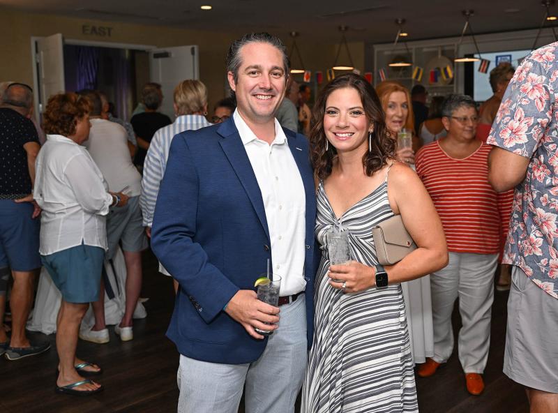 Dr. Justin Elder and his wife Susan enjoy the happy hour at the event.