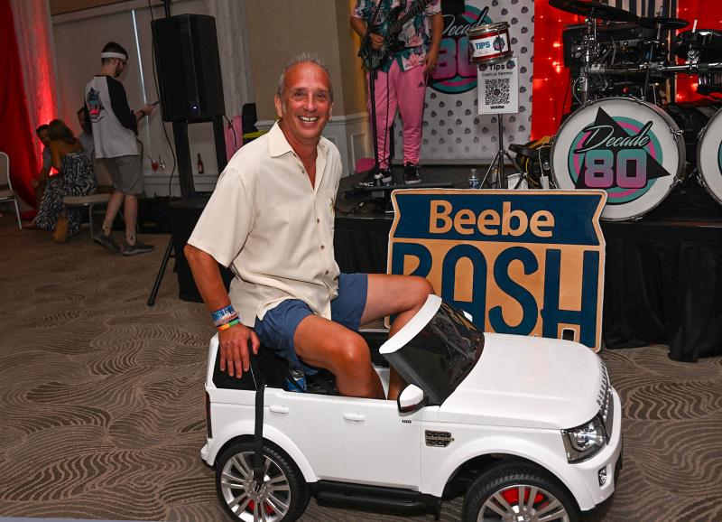 Glenn Parr takes a spin in his Land Rover purchased for $1,000 during the live auction.