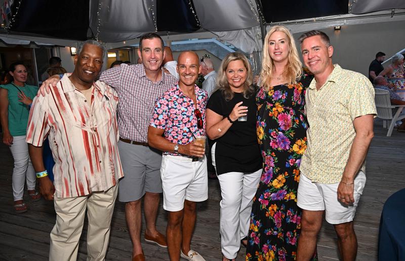Enjoying libations under the tent are (l-r) Randy Smith, Stephen Cremen, Jason Abela, Loretta Ostroski, Ashley Foster and Will Freshwater.