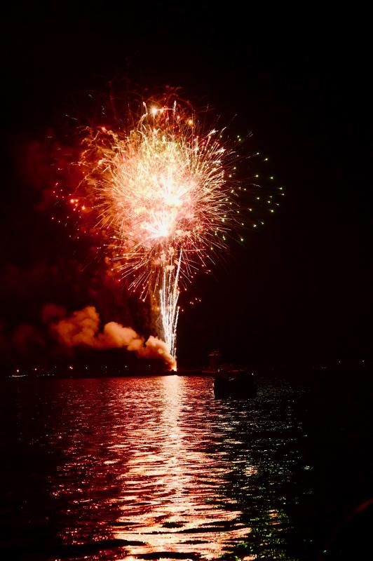 A bright red and white firework blasts over Delaware Bay off Lewes Beach. RON MACARTHUR PHOTO