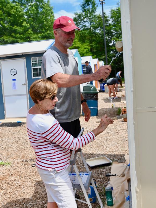 Phil and Mary Farrelly of Lewes work as a team to cut-in and roll paint.