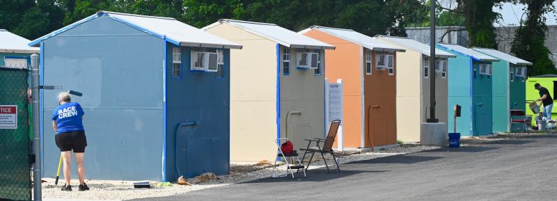 The Springboard Collaborative Pallet Village in Georgetown is getting a new look with coastal colors thanks to the work of dozens of volunteers coordinated by Kathleen Schell. Painting took place July 6-7 at the homeless community. RON MACARTHUR PHOTOS
