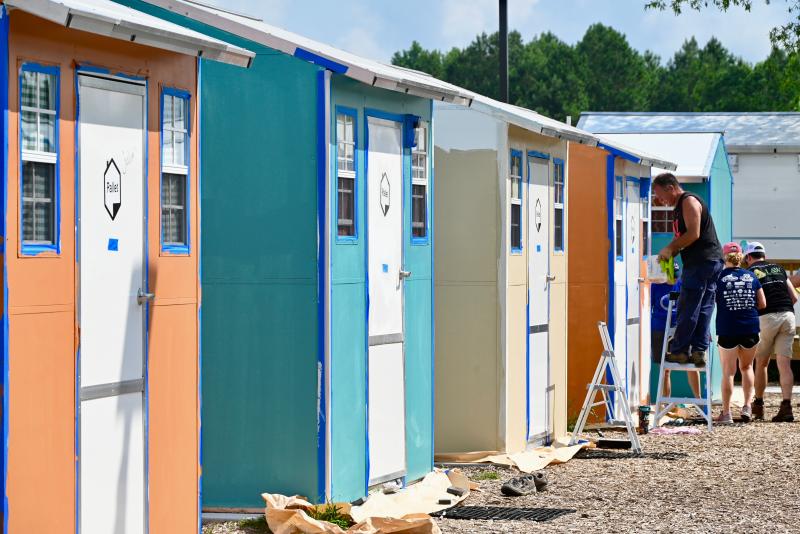 Springboard Pallet Village shelters are taking on a color scheme provided by the Schell Brothers design team.