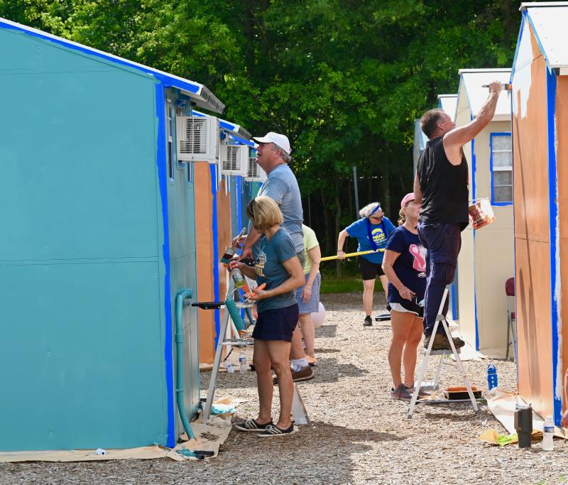 Dozens of volunteers turned out for two days of prep work and painting at the Springboard Pallet Village.