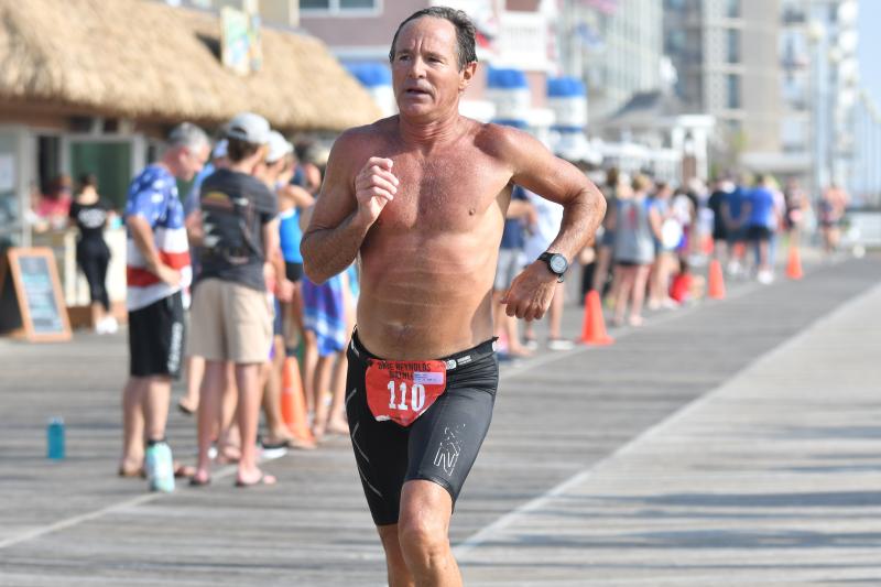 Dr. Rick Brokaw, 62, Cape High’s school psychologist, completes the biathlon in 45:17.